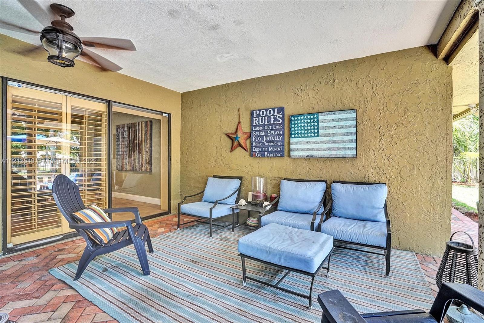 7360 Southwest 16th Street Plantation, FL 33317 - Photo 5 of 70 a living room with furniture and a window