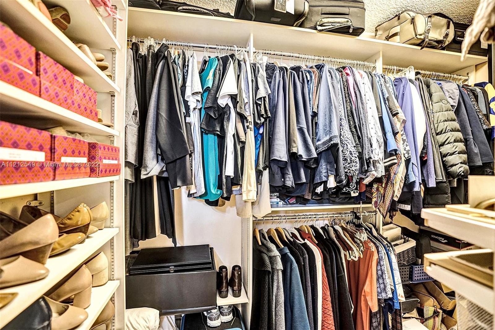 7360 Southwest 16th Street Plantation, FL 33317 - Photo 63 of 70 a view of walk in closet with clothes and shoes