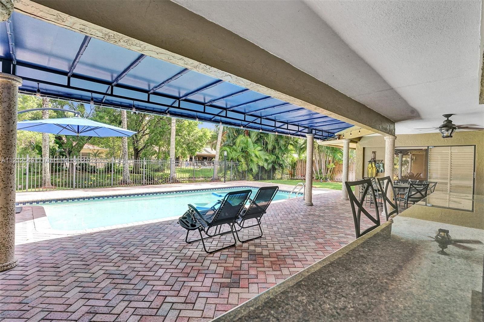 7360 Southwest 16th Street Plantation, FL 33317 - Photo 69 of 70 a view of a patio with a table chairs and a patio