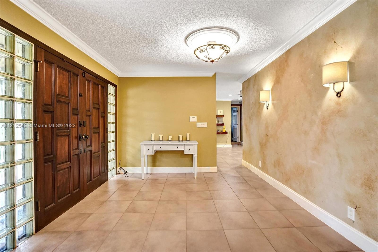 7360 Southwest 16th Street Plantation, FL 33317 - Photo 10 of 70 a spacious bathroom with a mirror and a shower