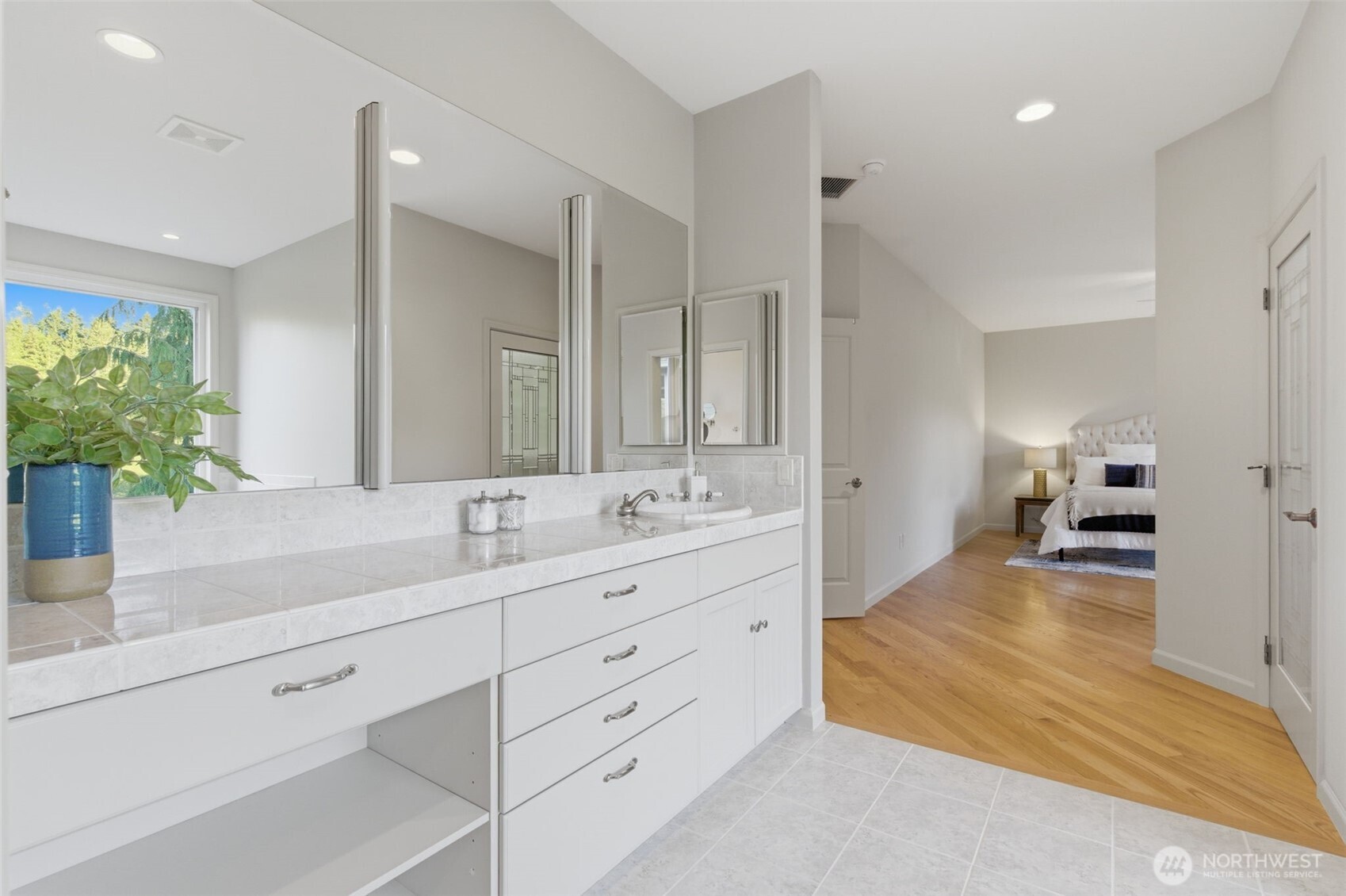2263 Lost Mountain Road Sequim, WA 98382 - Photo 16 of 40 a spacious bathroom with a double vanity sink and a mirror
