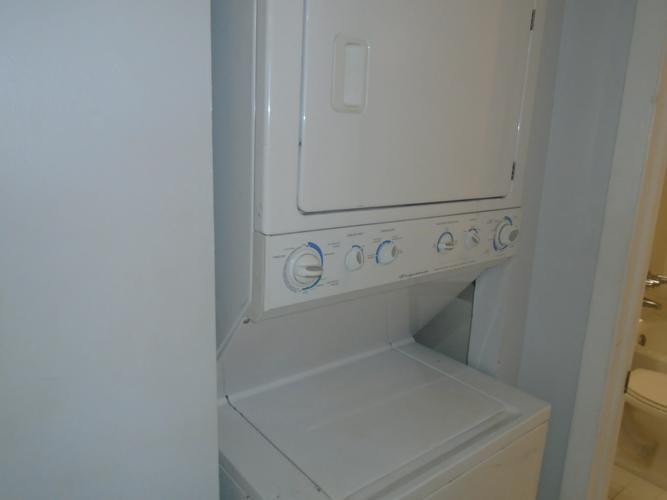 6195 Rock Island Road, Unit 402 Tamarac, FL 33319 - Photo 13 of 23 a utility room with dryer and washer