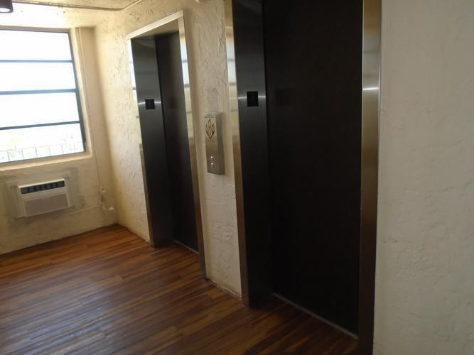 6195 Rock Island Road, Unit 402 Tamarac, FL 33319 - Photo 14 of 23 an empty room with wooden floor closet and windows