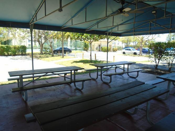 6195 Rock Island Road, Unit 402 Tamarac, FL 33319 - Photo 21 of 23 a view of a outdoor sitting area with furniture