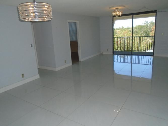 6195 Rock Island Road, Unit 402 Tamarac, FL 33319 - Photo 4 of 23 a view of an empty room with a window