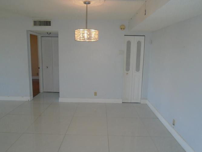 6195 Rock Island Road, Unit 402 Tamarac, FL 33319 - Photo 5 of 23 a view of an empty room with a window
