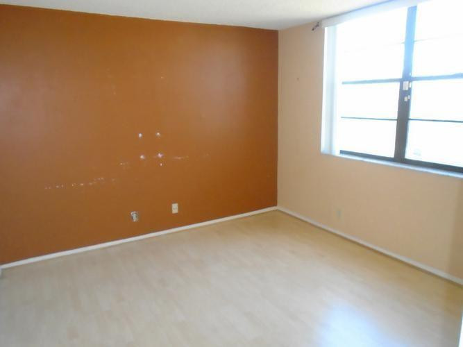 6195 Rock Island Road, Unit 402 Tamarac, FL 33319 - Photo 6 of 23 an empty room with a window
