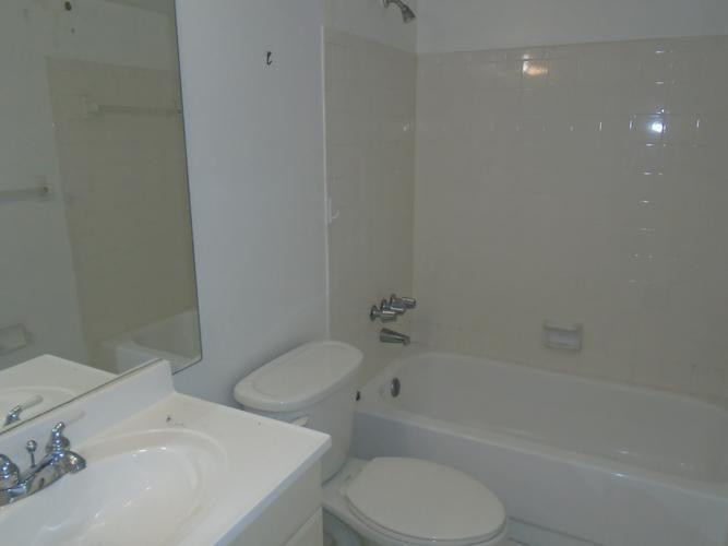 6195 Rock Island Road, Unit 402 Tamarac, FL 33319 - Photo 7 of 23 a bathroom with a sink toilet and bathtub
