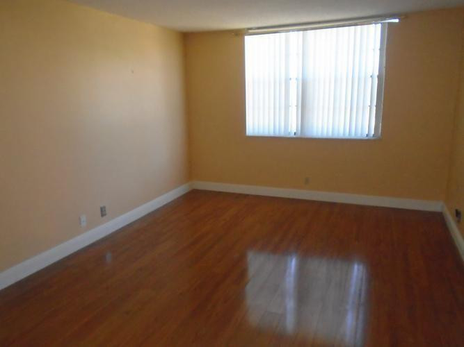 6195 Rock Island Road, Unit 402 Tamarac, FL 33319 - Photo 9 of 23 an empty room with a window