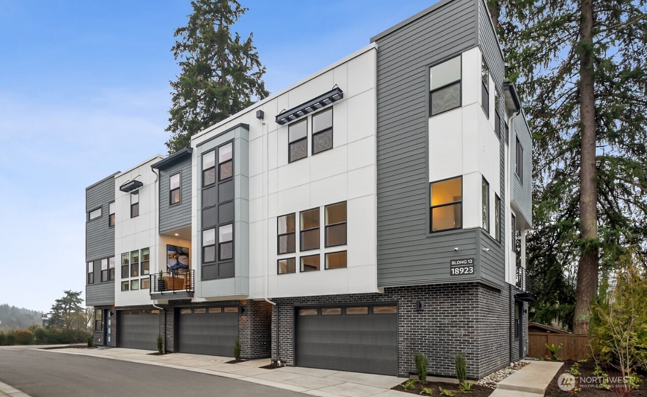 18809 99th Place Northeast, Unit C Bothell, WA 98011 - Photo 2 of 35 a front view of a building with balcony