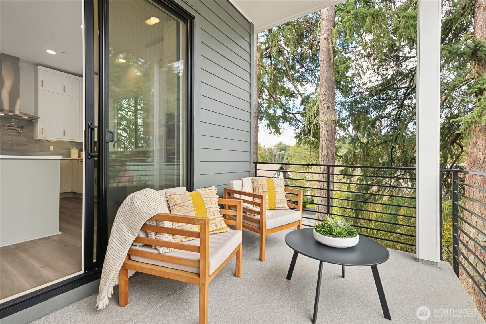 18809 99th Place Northeast, Unit C Bothell, WA 98011 - Photo 22 of 35 a balcony with table and chairs