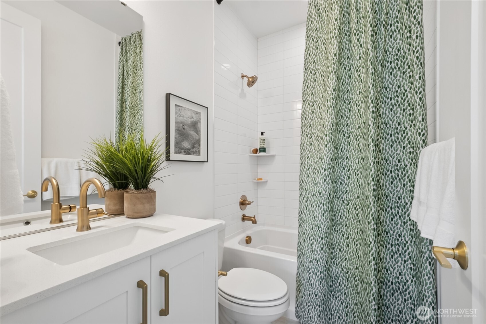 18809 99th Place Northeast, Unit C Bothell, WA 98011 - Photo 29 of 35 a bathroom with a sink a toilet and a mirror