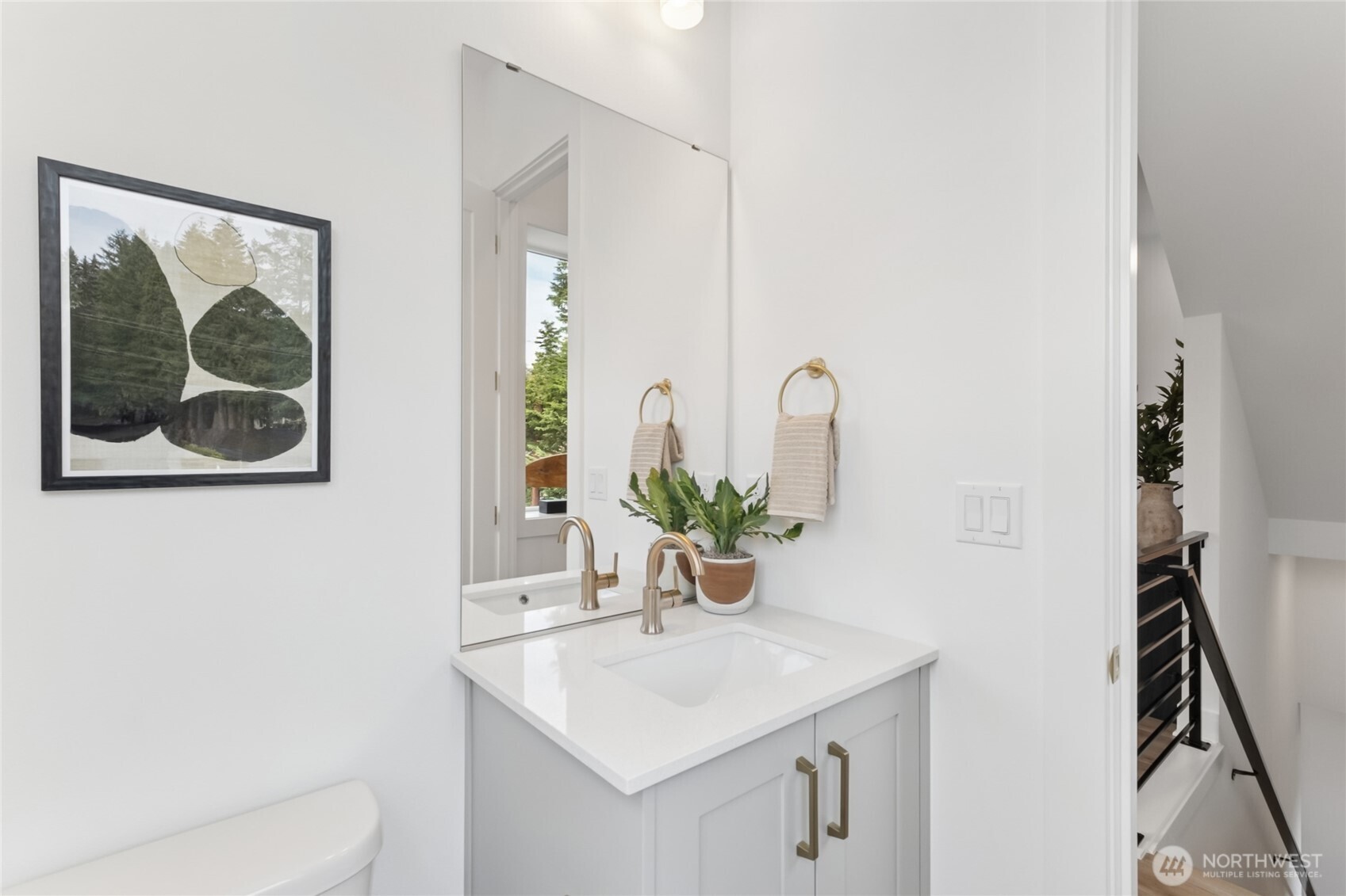 18809 99th Place Northeast, Unit C Bothell, WA 98011 - Photo 7 of 35 a bathroom with a sink and a mirror