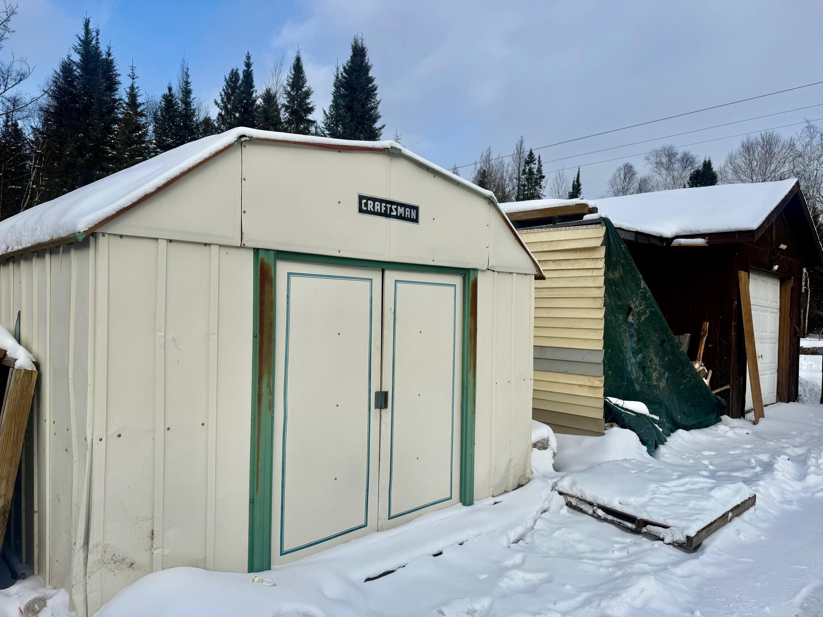 3031 South Leighton Road Hibbing, MN 55746 - Photo 6 of 8 Snow covered structure with a storage shed