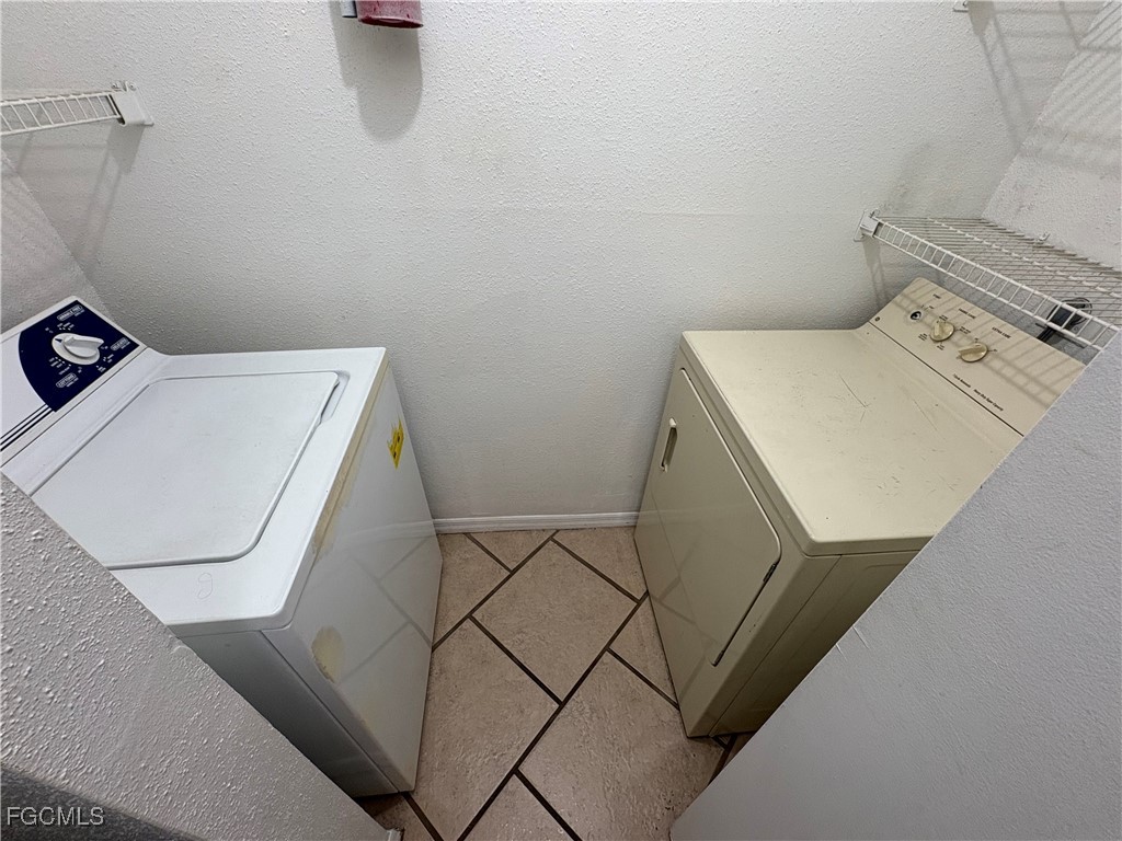 2855 Winkler Avenue, Unit 113 Fort Myers, FL 33916 - Photo 15 of 24 a utility room with dryer and washer