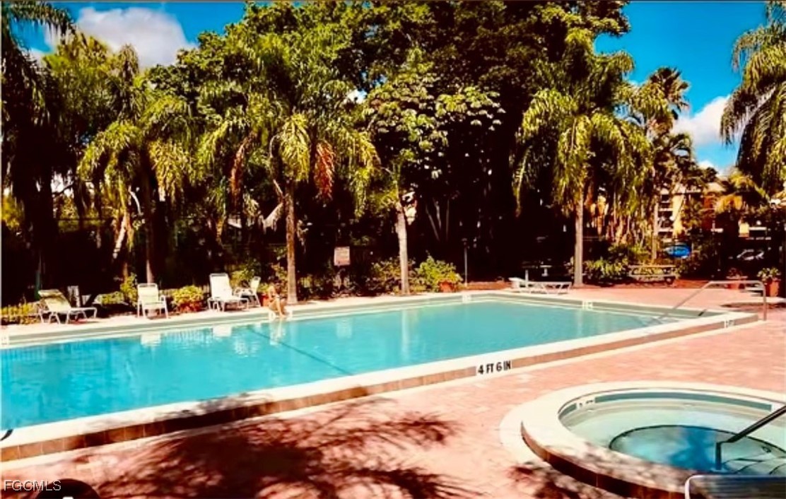 2855 Winkler Avenue, Unit 113 Fort Myers, FL 33916 - Photo 23 of 24 a view of a backyard with swimming pool