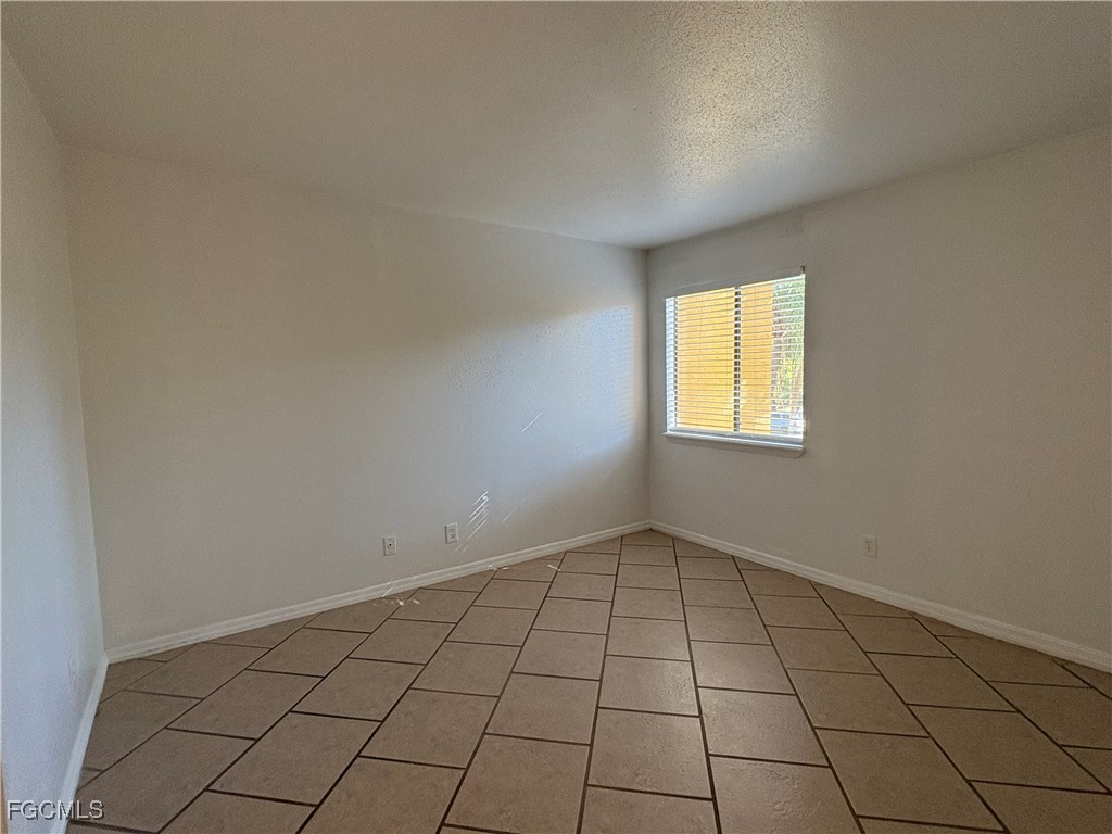 2855 Winkler Avenue, Unit 113 Fort Myers, FL 33916 - Photo 9 of 24 an empty room with windows