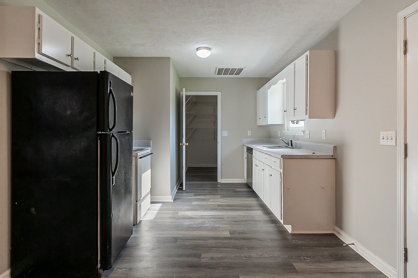 668 Crescent Road Murfreesboro, TN 37128 - Photo 2 of 24 a view of a kitchen with a sink and a refrigerator