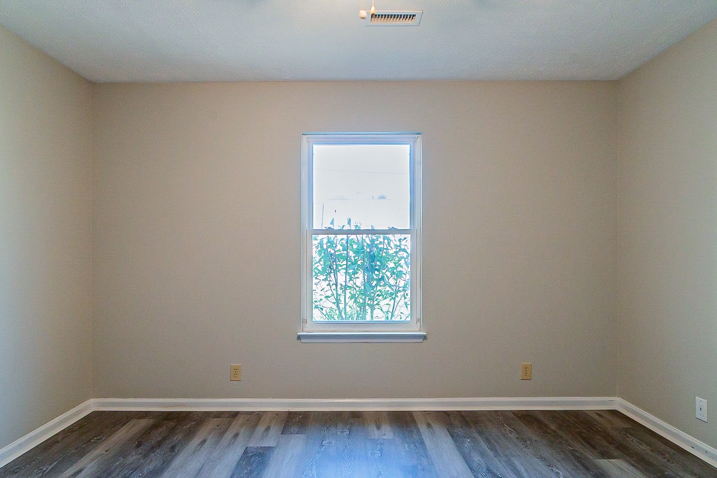 668 Crescent Road Murfreesboro, TN 37128 - Photo 11 of 24 a view of an empty room with wooden floor and a window