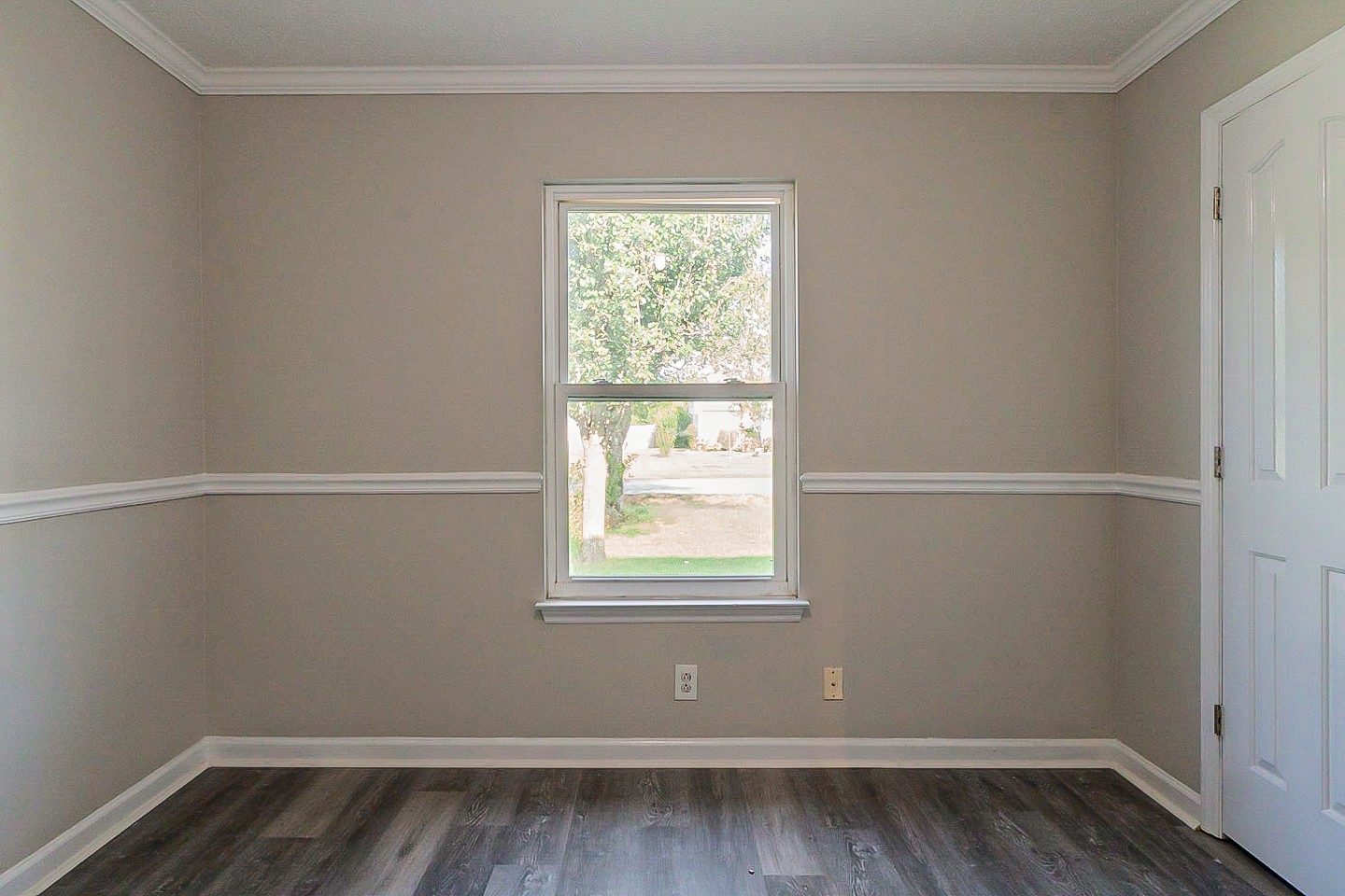 668 Crescent Road Murfreesboro, TN 37128 - Photo 17 of 24 a view of an empty room with wooden floor and a window