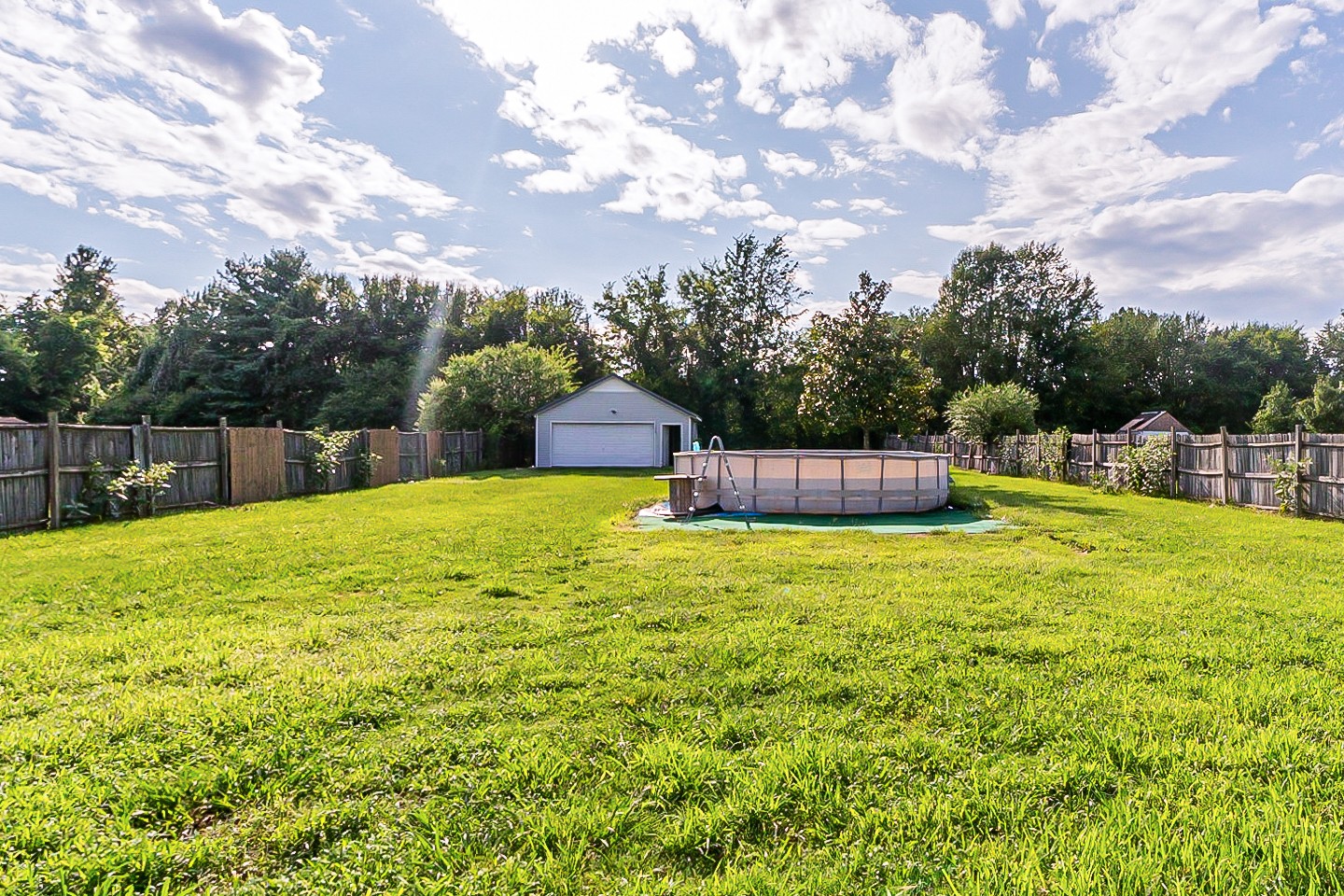 668 Crescent Road Murfreesboro, TN 37128 - Photo 20 of 24 a house view with swimming pool and trees in the background