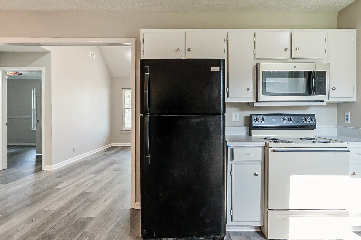 668 Crescent Road Murfreesboro, TN 37128 - Photo 7 of 24 a kitchen with a refrigerator and a stove top oven