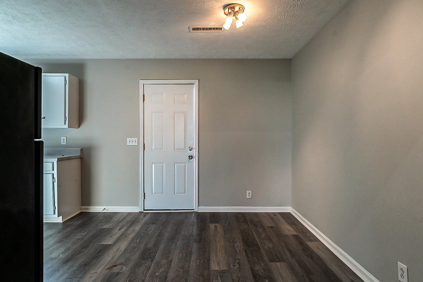 668 Crescent Road Murfreesboro, TN 37128 - Photo 9 of 24 an empty room with wooden floor and entrance