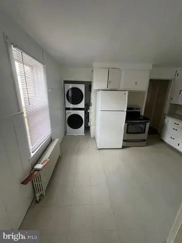 a view of a storage & utility room with a window