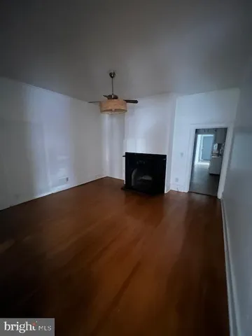 a view of empty room with a fireplace