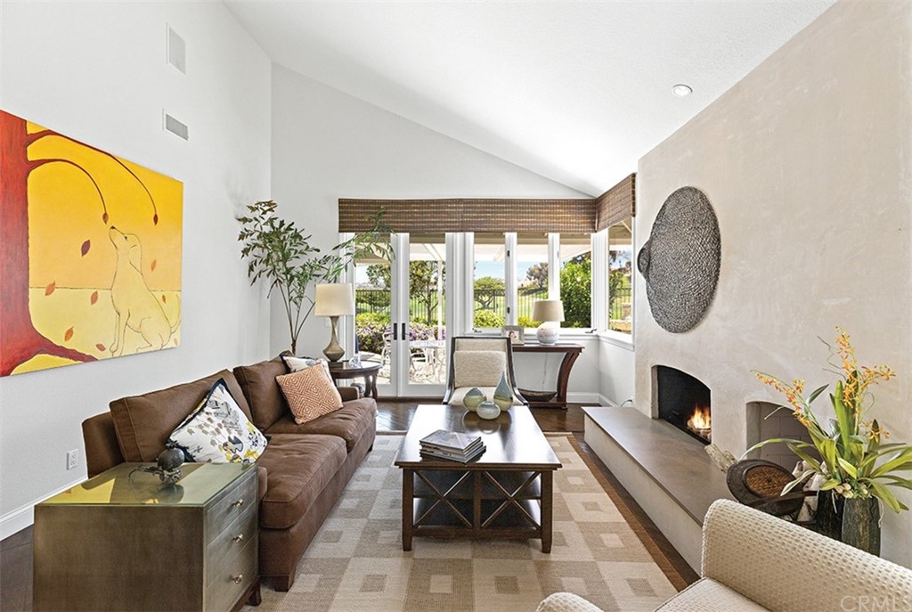 13 Guadalmina Drive Dana Point, CA 92629 - Photo 11 of 26 a living room with furniture a fireplace and a large window