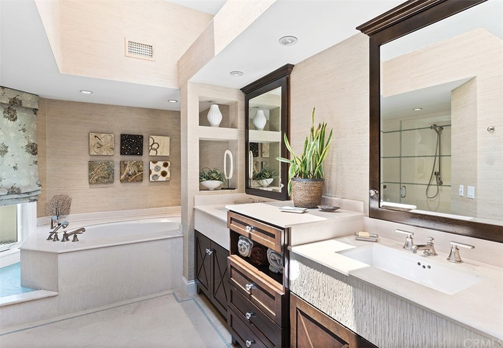 13 Guadalmina Drive Dana Point, CA 92629 - Photo 17 of 26 a bathroom with a double vanity sink a bathtub and next to a window