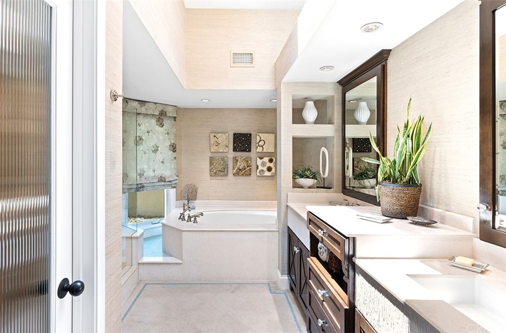 13 Guadalmina Drive Dana Point, CA 92629 - Photo 18 of 26 a bathroom with a bathtub sink and mirror