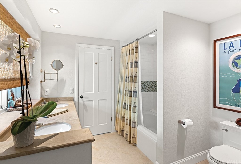 13 Guadalmina Drive Dana Point, CA 92629 - Photo 21 of 26 a bathroom with a granite countertop sink a toilet and shower