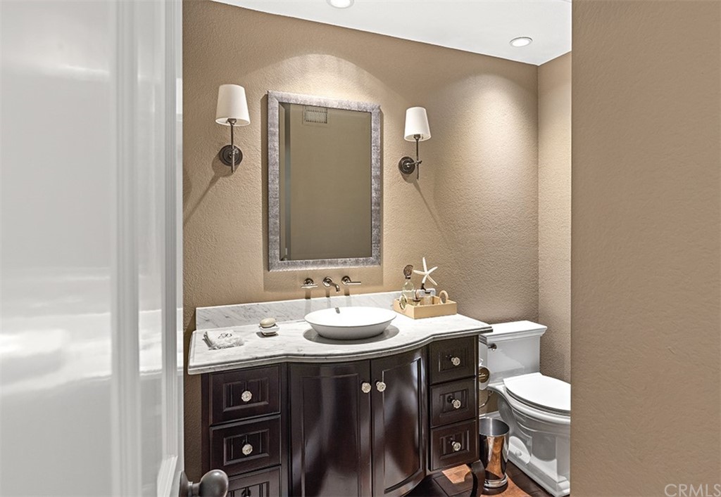 13 Guadalmina Drive Dana Point, CA 92629 - Photo 22 of 26 a bathroom with a double vanity sink toilet and mirror