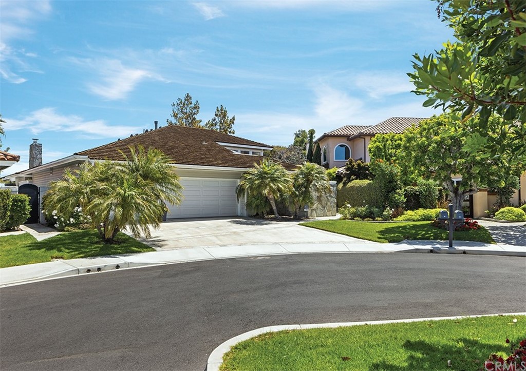 13 Guadalmina Drive Dana Point, CA 92629 - Photo 23 of 26 a front view of a house with a yard and garage