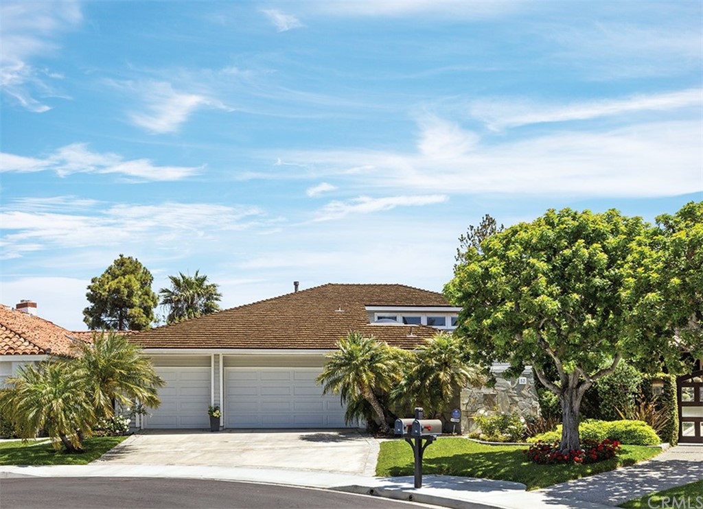 13 Guadalmina Drive Dana Point, CA 92629 - Photo 24 of 26 a front view of a house with a yard and garage