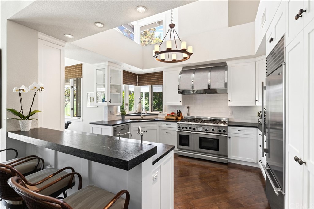 13 Guadalmina Drive Dana Point, CA 92629 - Photo 8 of 26 a kitchen with stainless steel appliances granite countertop a stove and a sink