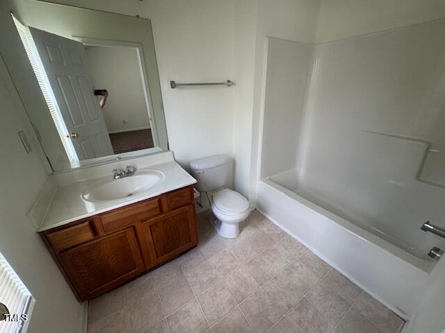 3363 Bridgeville Road Raleigh, NC 27610 - Photo 7 of 10 a bathroom with a sink a toilet and shower