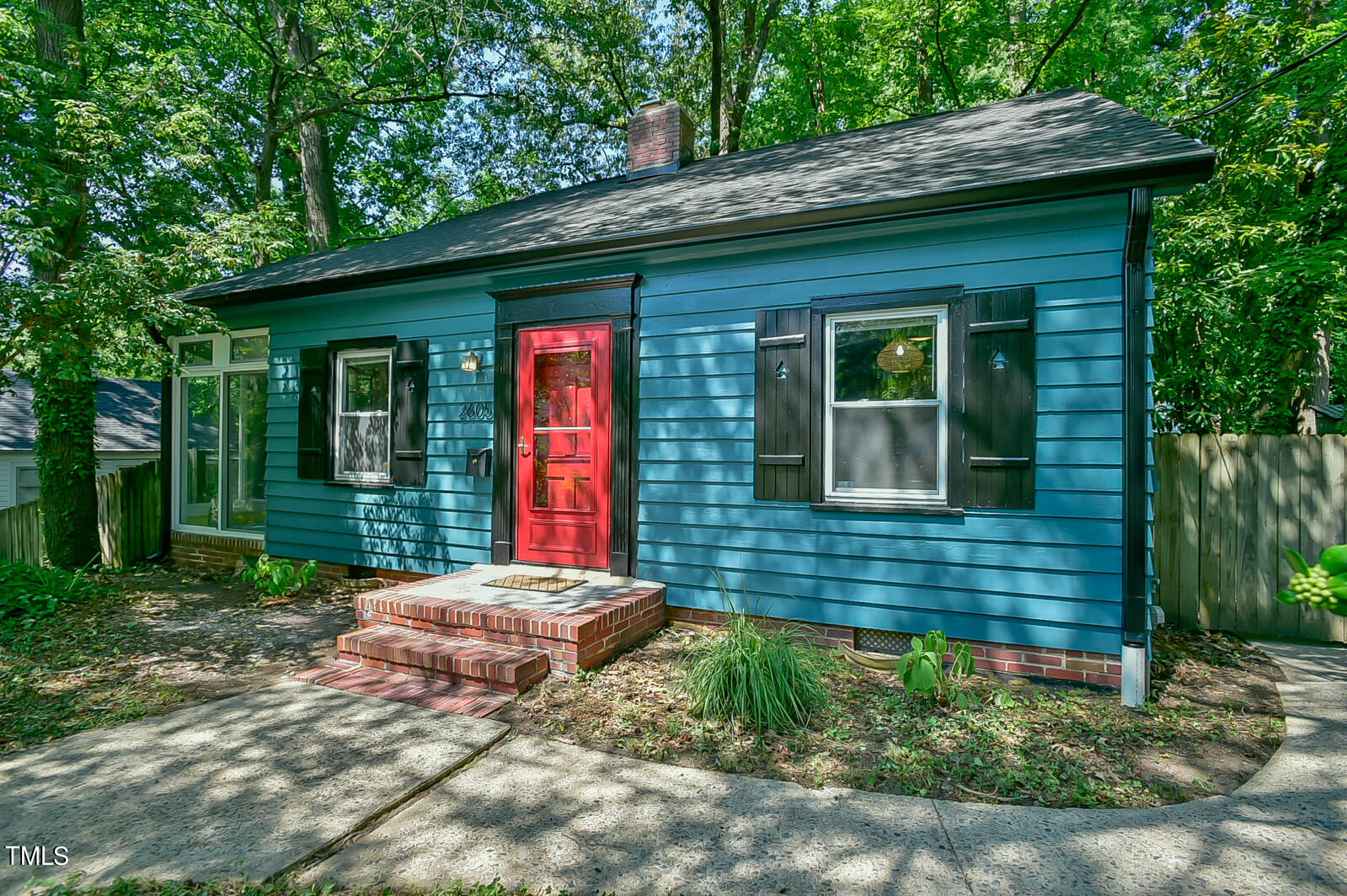 2605 Elgin Street Durham, NC 27704 - Photo 1 of 39 a front view of a house with garden