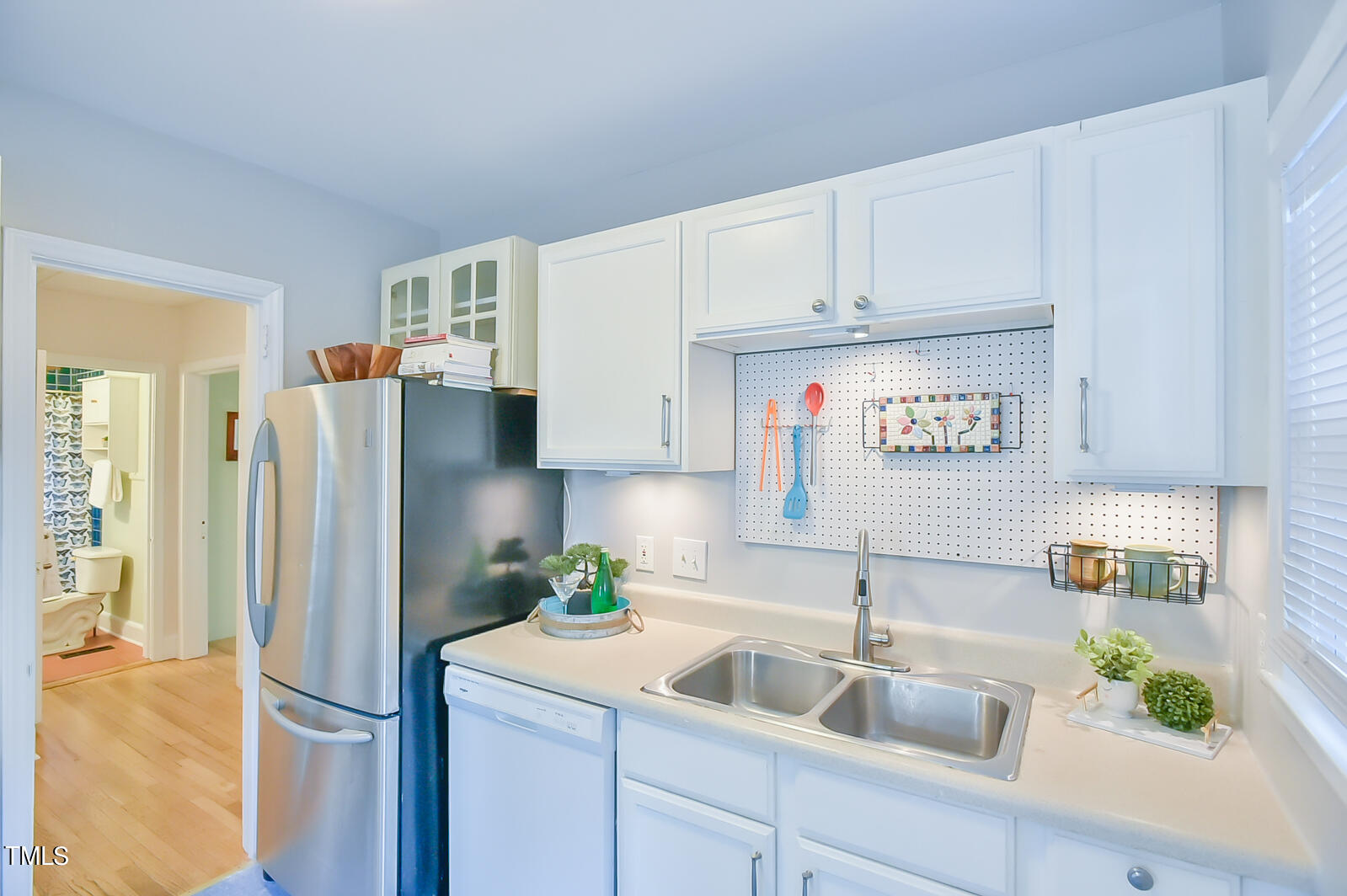 2605 Elgin Street Durham, NC 27704 - Photo 18 of 39 a kitchen with stainless steel appliances granite countertop a refrigerator and a sink