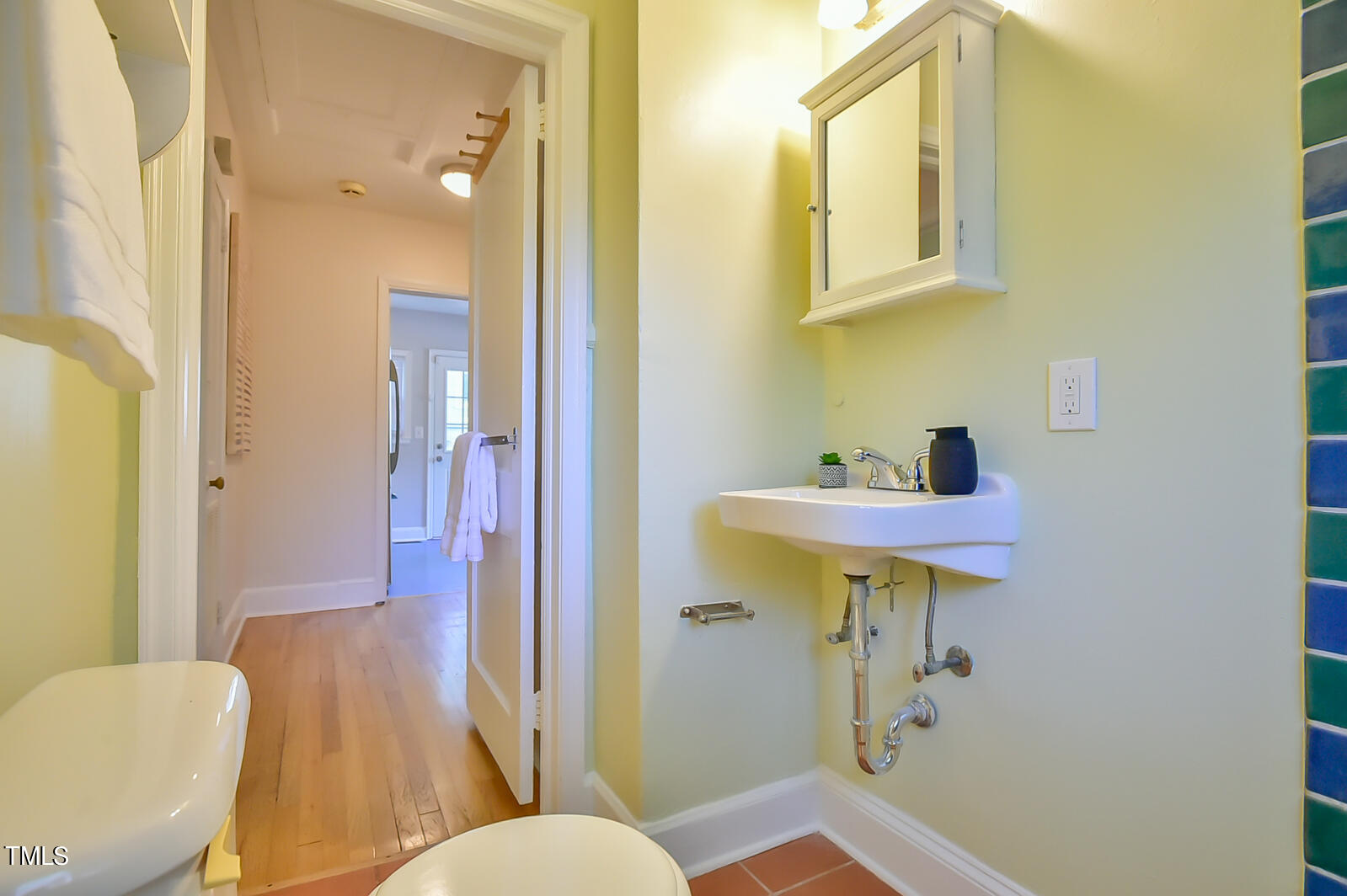 2605 Elgin Street Durham, NC 27704 - Photo 21 of 39 a bathroom with a sink toilet and shower