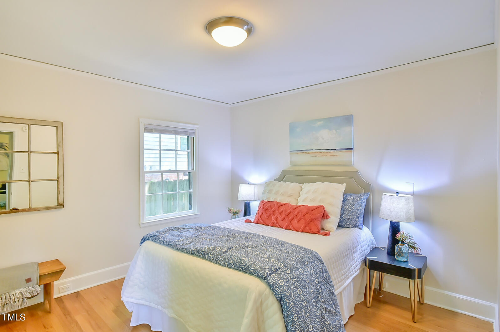 2605 Elgin Street Durham, NC 27704 - Photo 26 of 39 a bedroom with a bed and wooden floor
