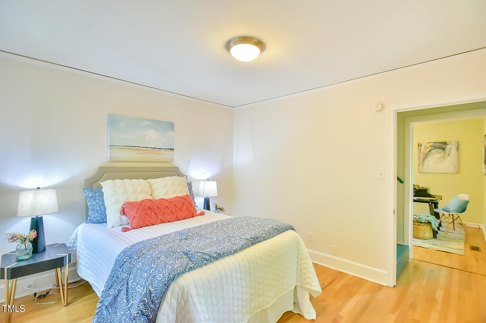 2605 Elgin Street Durham, NC 27704 - Photo 28 of 39 a bedroom with a bed and a lamp on the dresser