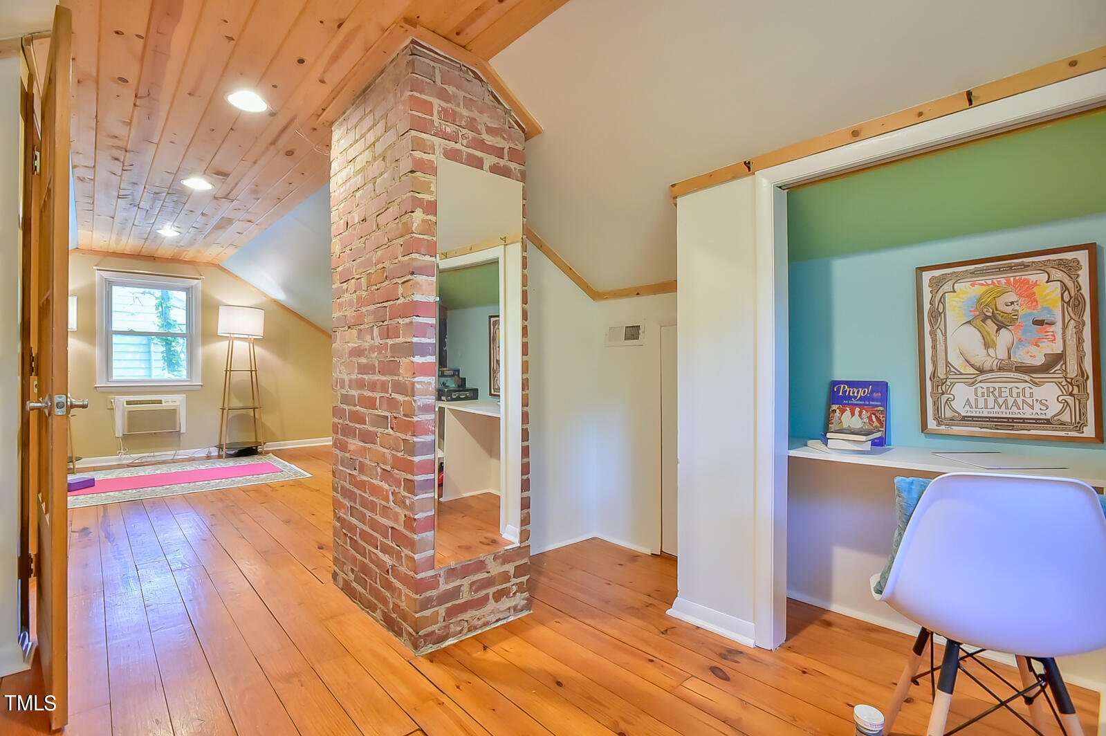2605 Elgin Street Durham, NC 27704 - Photo 33 of 39 a bedroom with a bed and a chair with the wooden floor