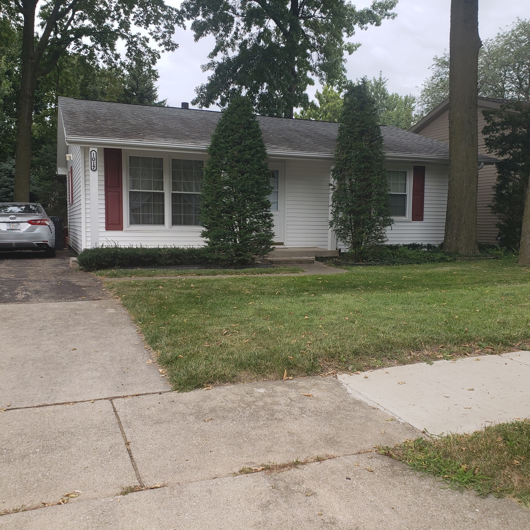 1017 Morgan Street Normal, IL 61761 - Photo 1 of 15 a front view of a house with a garden