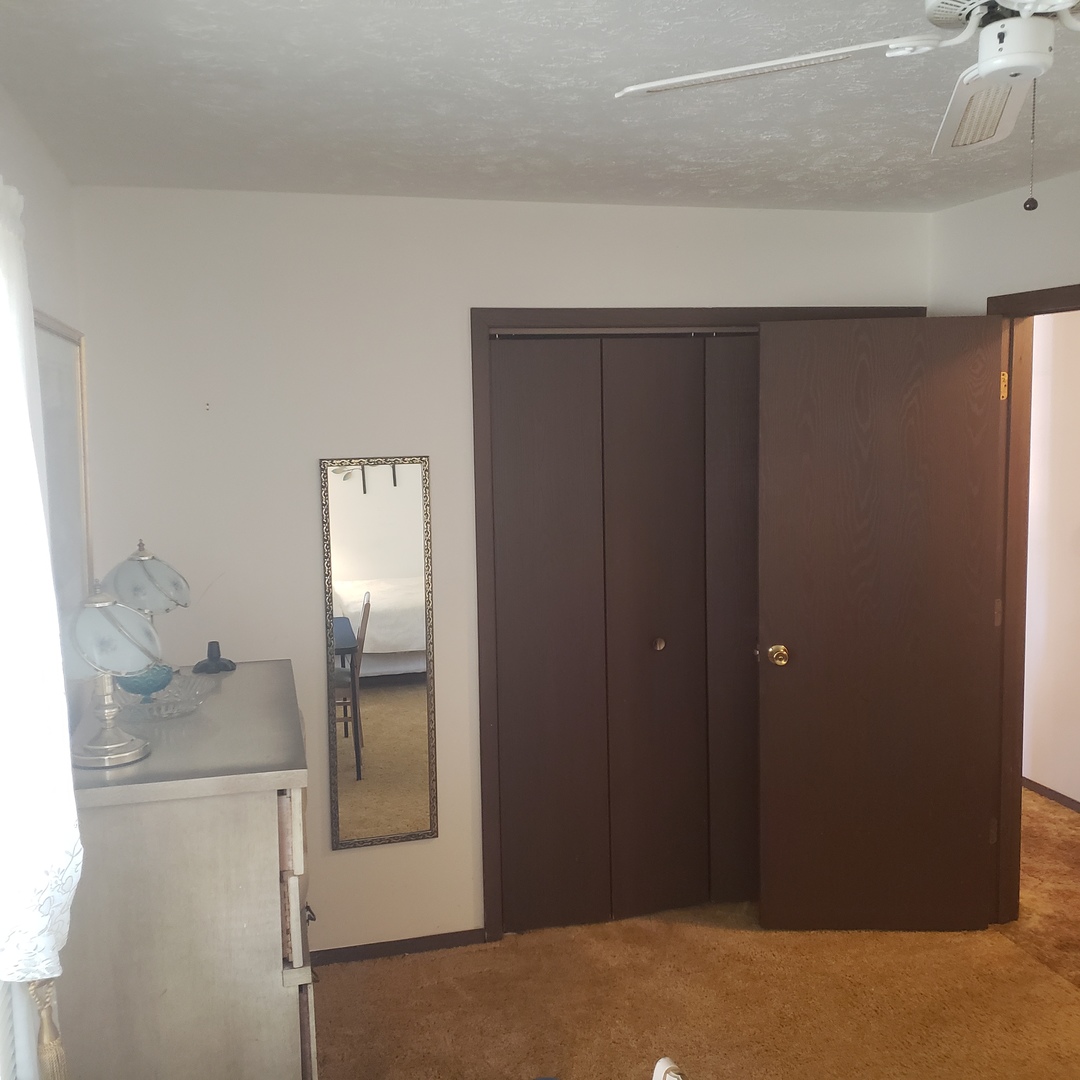 1017 Morgan Street Normal, IL 61761 - Photo 13 of 15 a bathroom with a granite countertop mirror and vanity