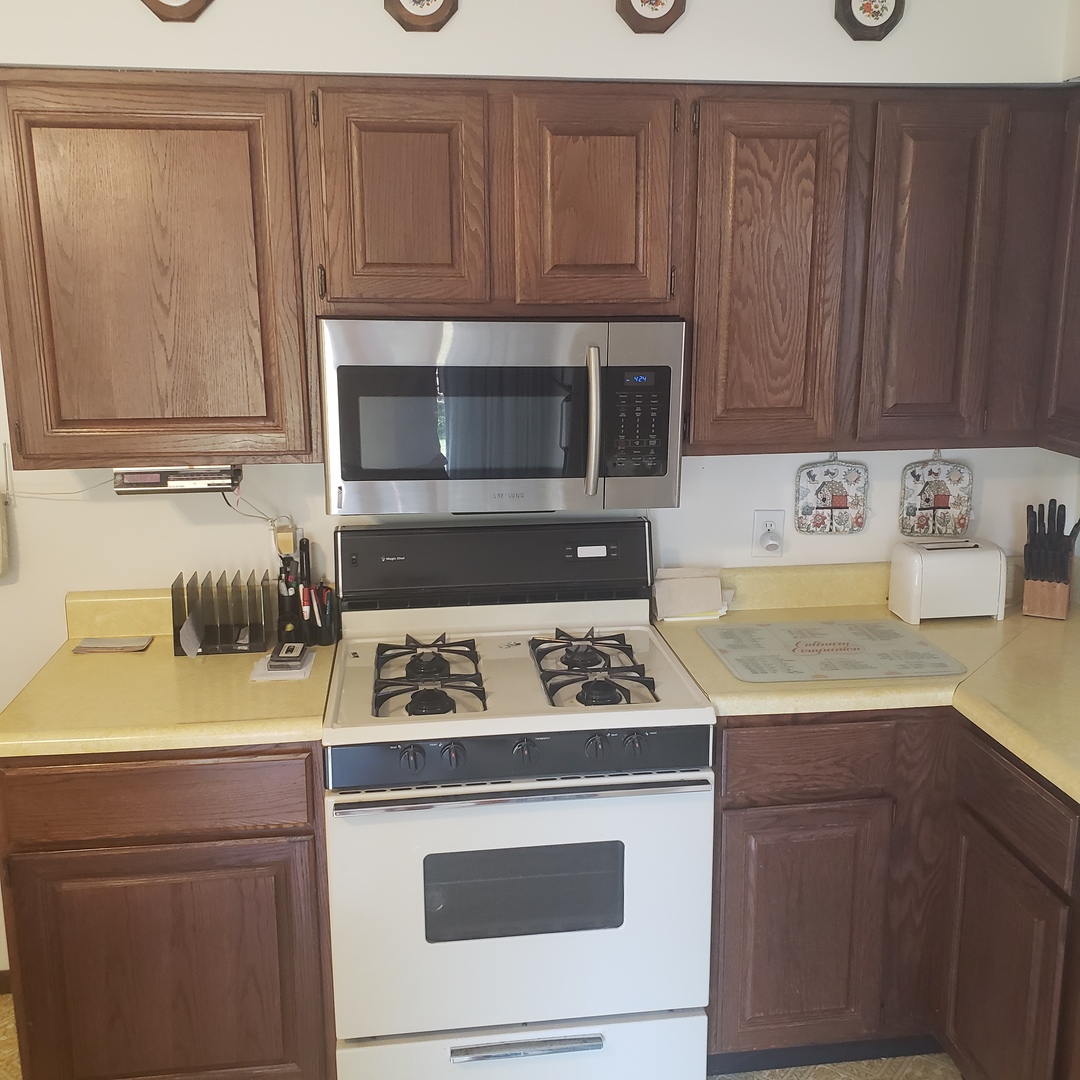 1017 Morgan Street Normal, IL 61761 - Photo 7 of 15 a kitchen with a sink stove and microwave