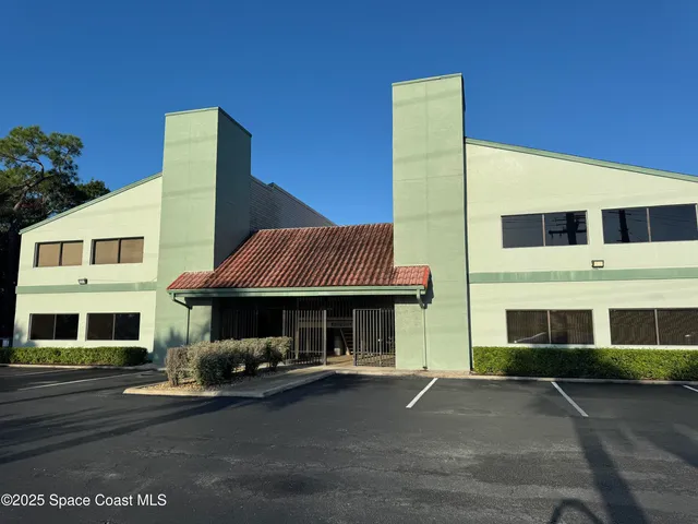 a front view of a house with swimming pool