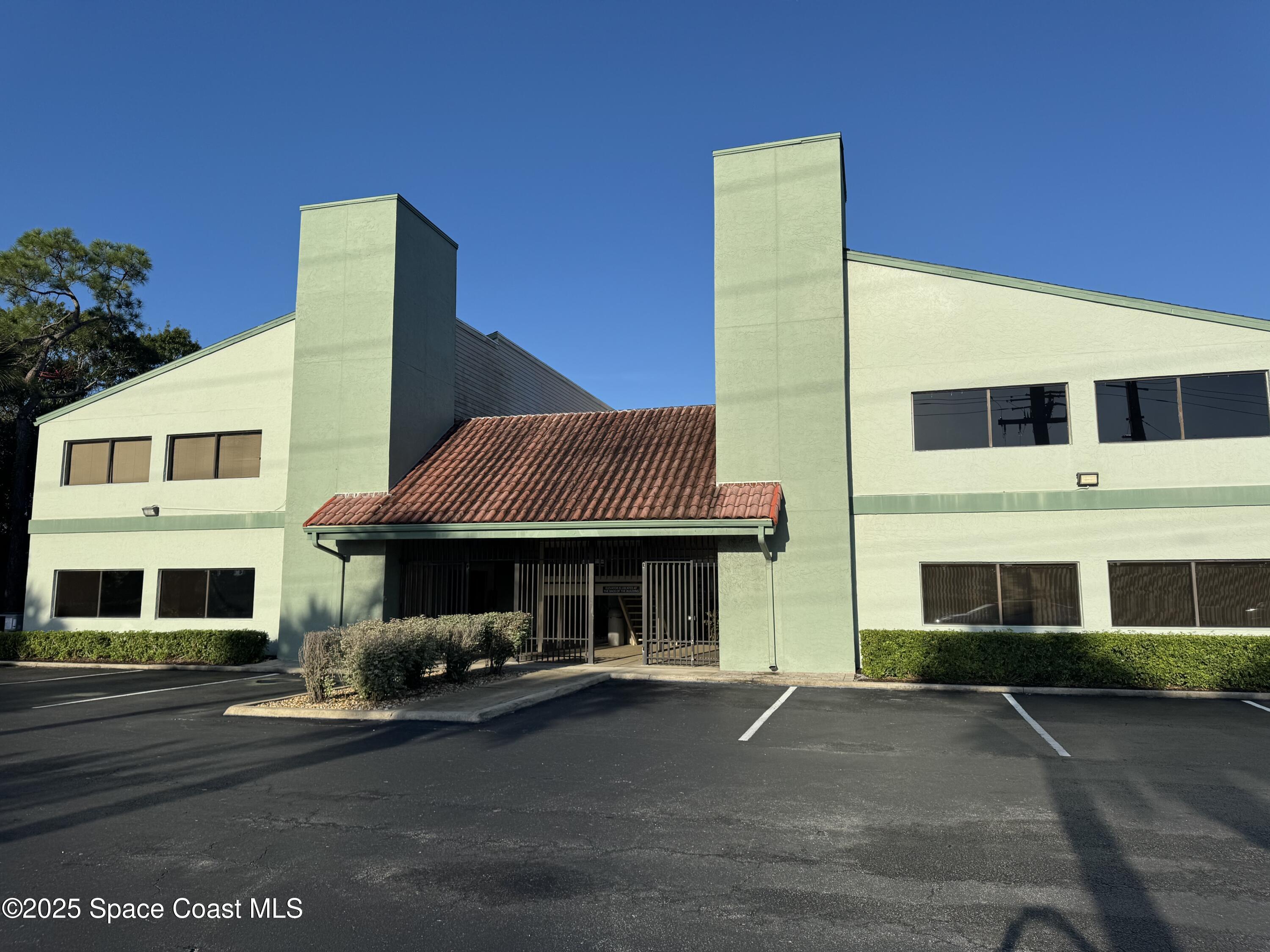 a front view of a house with swimming pool