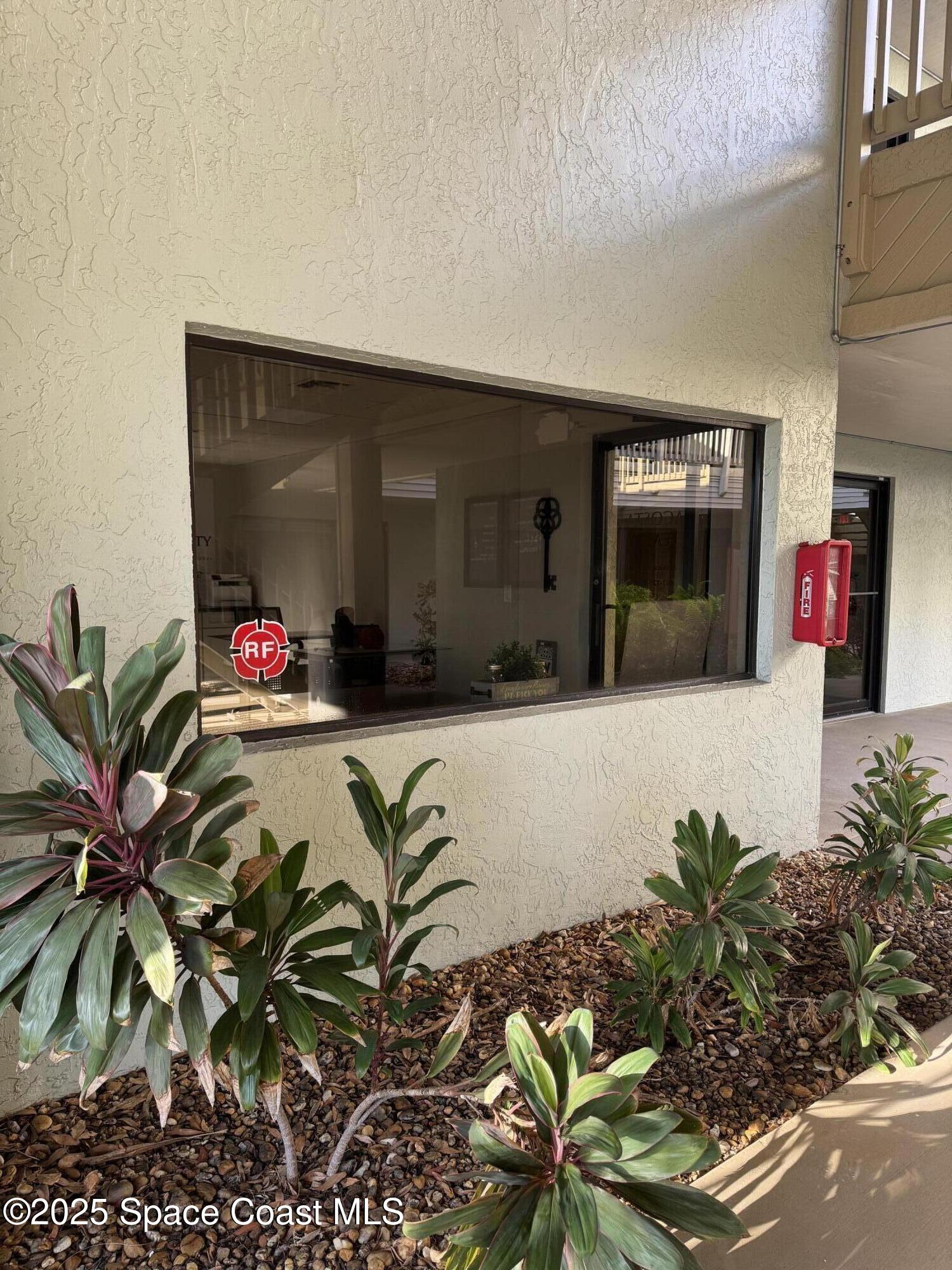 700 North Wickham Road, Unit 101 Melbourne, FL 32935 - Photo 2 of 12 a vase of flowers sitting on a floor